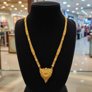 Gold Necklace with Intricate Pendant Design